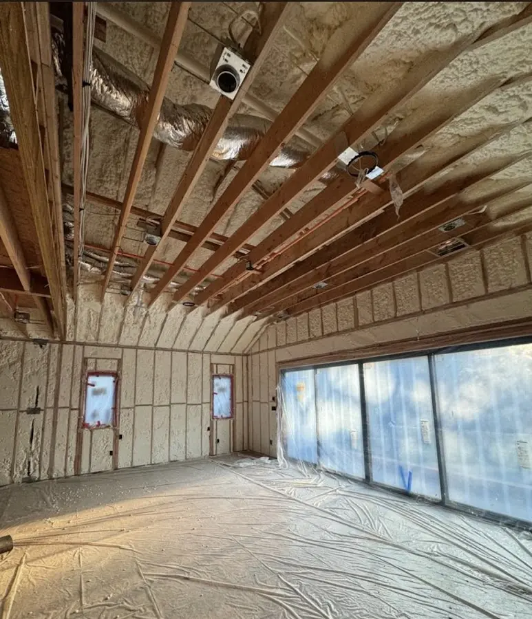 Interior walls and ceiling insulated with spray foam during new construction in Mundelein